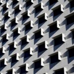a-modern-multi-storey-residential-building-wall-with-symmetrical-windows